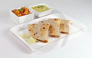 Chapati Indian Flat Bread with Dal and Chana Dal Masala as Side Dishes