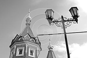 Chapel of Alexander Nevsky and street light. Black and white photo.