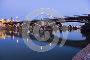 Chapel of Carmen and Isabel II Bridge in Seville photo