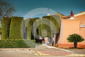 Chapel and green garden trees