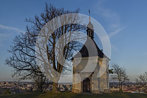 Chapel on hill over Trebic town in Moravia region in sunset evening