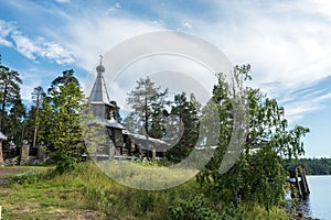 Chapel in the name of all Valaam saints on the coast of the island surrounded by beautiful trees and shrubs