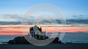 Chapel Senhor da Pedra at Miramar Beach at night time, Atlantic ocean, Porto