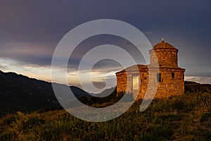 chapel at sunset in the mountains