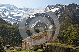 A chapel surrounded by mountains, located next to Roc de la Peche hut photo