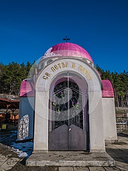 Chapel or tabernacle with pink purple dome. Saint Peter and Pavel.