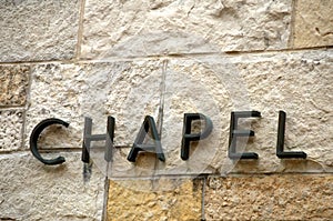 Chapel text on stone-angle