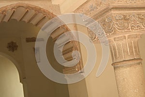 Chapiter column and Nasrid arch in palace of Alcazaba, Malaga, Spain photo