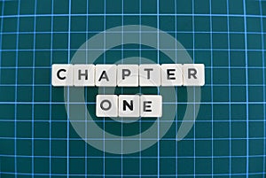 Chapter one word made of square letter word on green square mat background