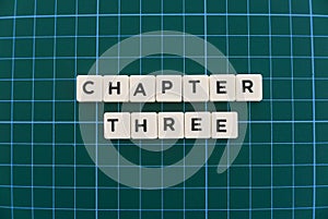 Chapter three word made of square letter word on green square mat background