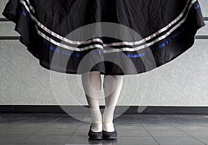 Character ballet parallel position with skirt held