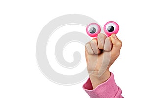 Character depiced with googly eyes and childs hand.