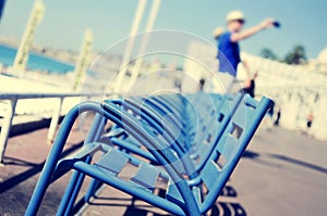 characteristic blue chairs at the Promenade des Anglais in Nice, France