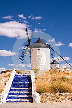 Characteristic blue painted staircase and Consuegra Windmill (Spain)