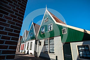 Characteristic Dutch architecture of wooden house with vivid col