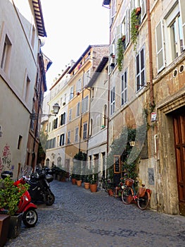 Characteristic narrow street in the historical center of Rome in Italy.