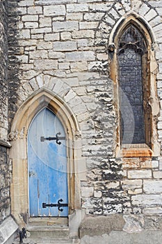 Characteristic old gothic door and window, London, England
