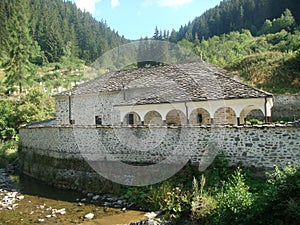 Traditional stone orthodox church in the National Park of the Rhodopes in Bulgaria.