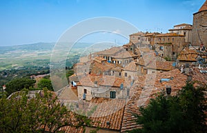 Characteristic terracotta rooftops and outlook over rural Italian landscape