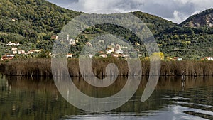 The characteristic village of Massaciuccoli seen from the homonymous lake, Lucca, Tuscany, Italy photo