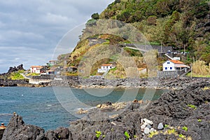 Characteristic volcanic formations next to the sea forming natural pools and water diversions photo