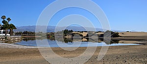 Charca of Maspalomas with intense blue sky photo