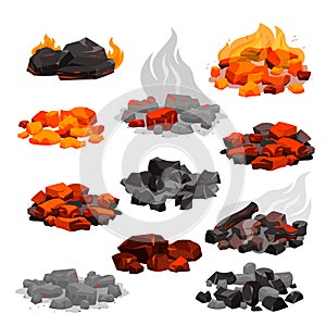 Charcoal black embers pile and hot rocks burn in fireplace with red bright flame, ash and smoke, burnt glowing stones