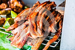 Charcoal boiled pork neck on grill