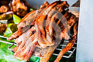 Charcoal boiled pork neck on grill