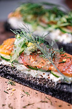 Charcoal Bread Smoked Salmon Sandwiches on wood board