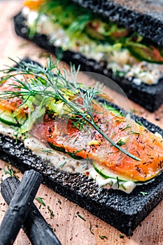 Charcoal Bread Smoked Salmon Sandwiches on wood board