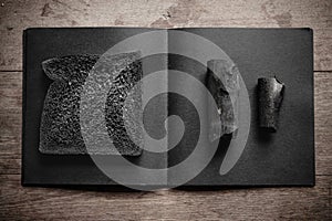 Charcoal breads loaf on wooden background