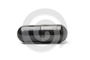 Charcoal capsule isolated on white background