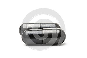 Charcoal capsule isolated on white background