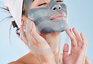 Charcoal face mask for healthy skincare, wellness of facial skin and beauty product for body care against blue mockup