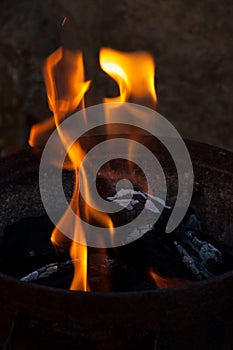 Charcoal flame and ember photo