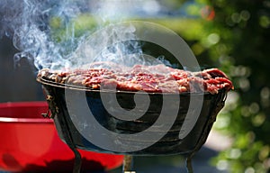 Charcoal grill carne asada grilling in the streets of Miami Beach south Florida photo