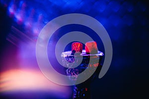 Charcoal for Shisha on the bowl of hot red on a blue background