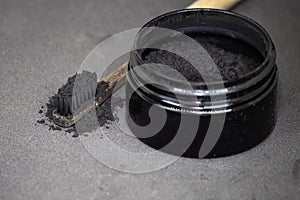 Charcoal on a toothbrush to whiten teeth photo