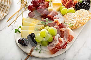 Charcuterie board with cheese and meat photo