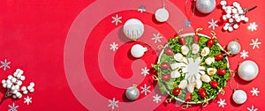 Charcuterie wreath in traditional New Year color design with Christmas decorations. Modern snack