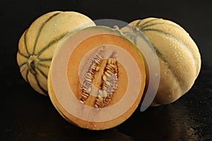 Charentais with half on black background