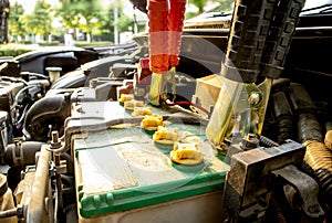 Charge the battery for start engine in engine room of old car