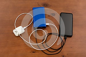 Charge sharing: recharging a cellphone and air pods with a power bank