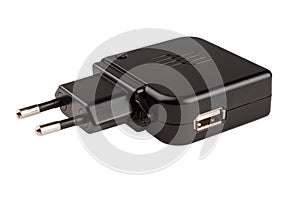 Charger for smartphone or tablet from the network with micro USB cable, detachable cable, power supply isolated on white