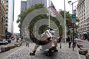 Charging Bull, aka the Wall Street Bull, bronze sculpture on Broadway at Bowling Green, New York, NY