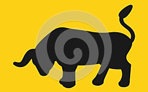 A charging bull bold black silhouette set against a yellow backdrop