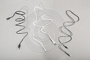 Charging cables  for phone on grey background - Image