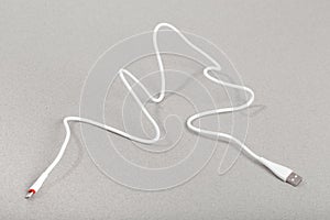 Charging cables  for phone on grey background - Image