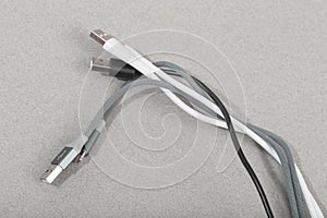 Charging cables  for phone on grey background - Image